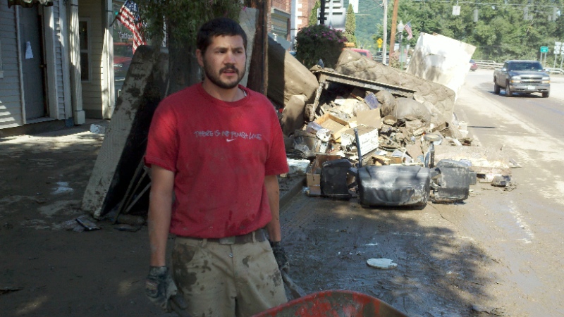 MIDDLEBURGH, NY - Alex Kutinsky, 24, helped his brother carry a lifetime of ruined belongings to the curb Wednesday. "Come to Schoharie and see what everybody lost, he said. "Nobody has a home and winter's coming." Photo by Marty Rosen.
